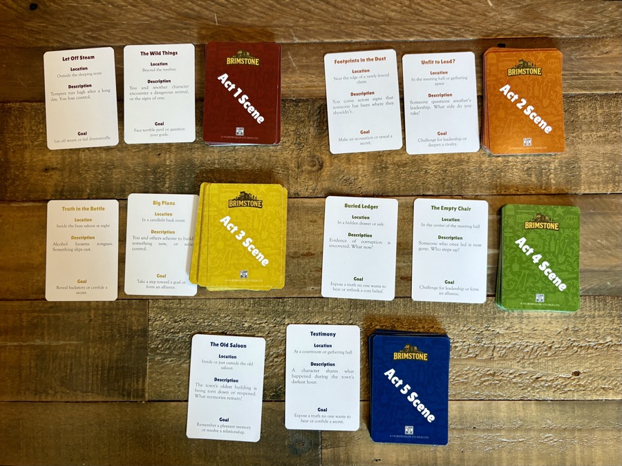 Brimstone Scene cards arranged by act on a wooden table